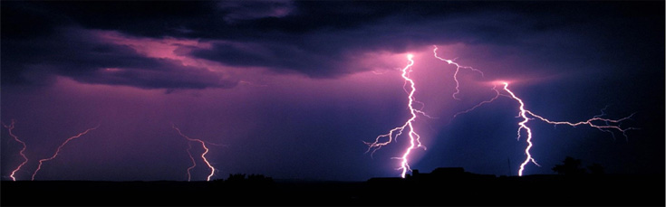 Whoosh! The trade wins blew up a storm purple sky with lightning striking the ground in the distance